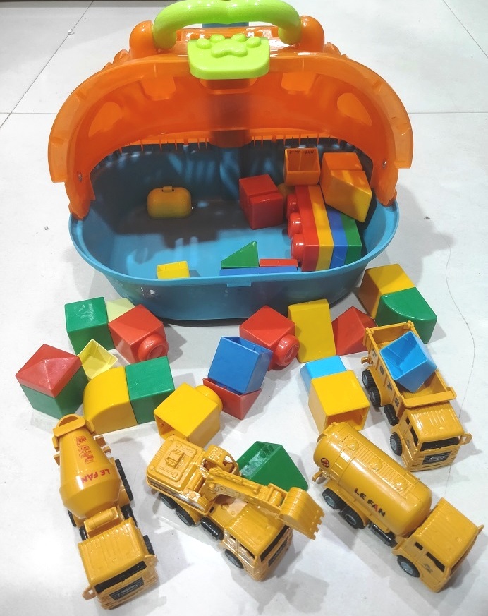 CONSTRUCTION VEHICLES WITH TROLLEY BLOCKS